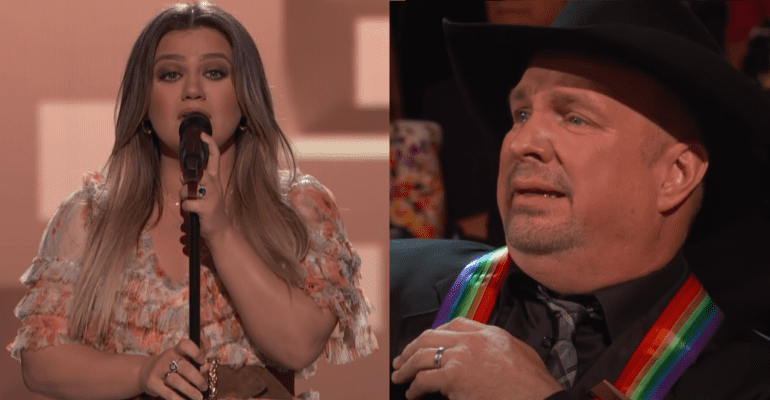 Garth Brooks and woman singing into microphones