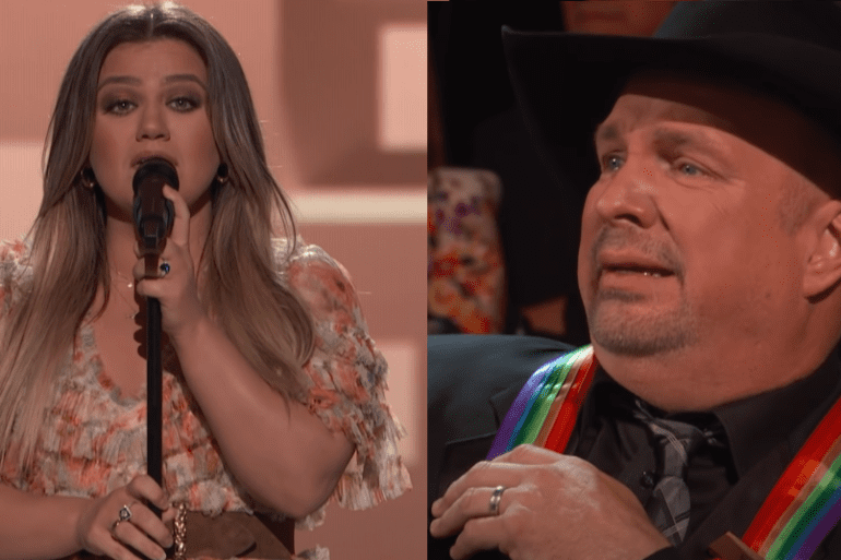 Garth Brooks and woman singing into microphones