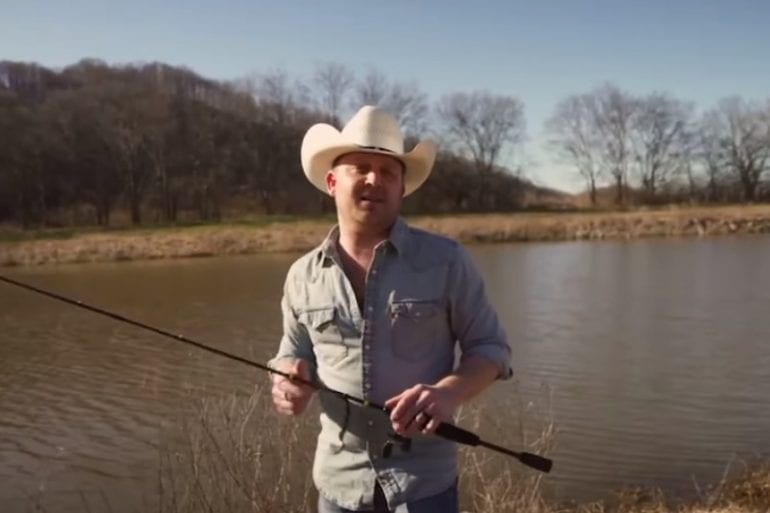 A man holding a fishing pole