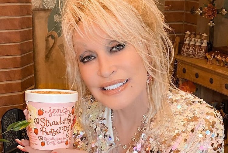 Dolly Parton holding a cup of coffee