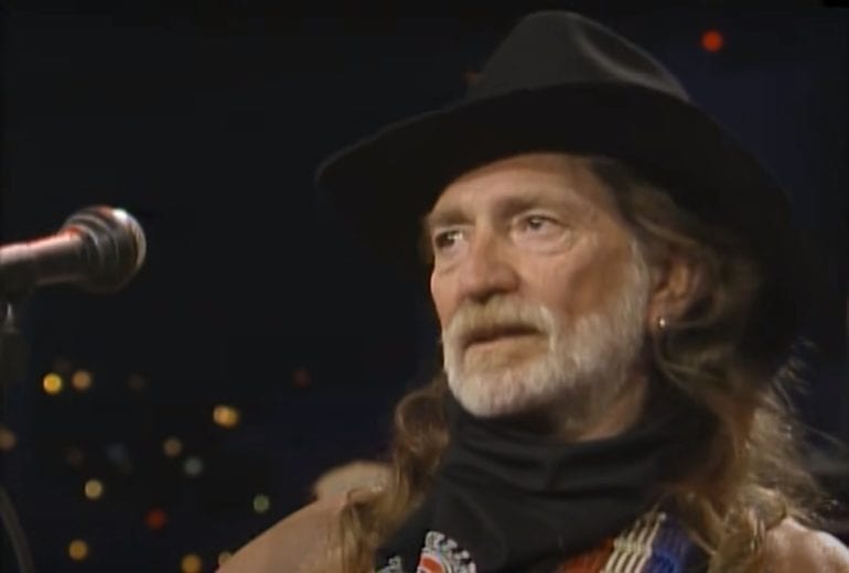 Willie Nelson with a beard and a hat