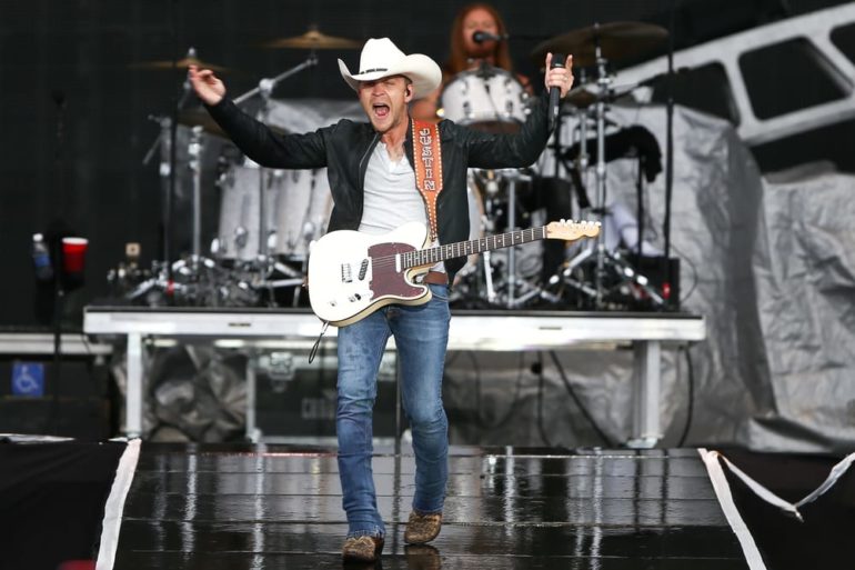 Justin Moore holding a guitar