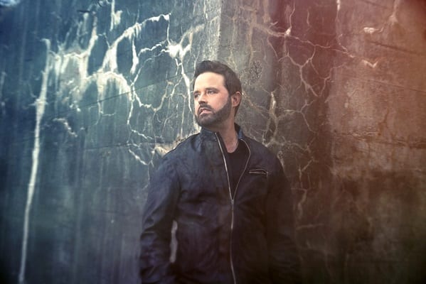 Randy Houser standing in front of a wall