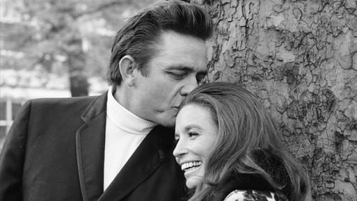 June Carter Cash and woman kissing