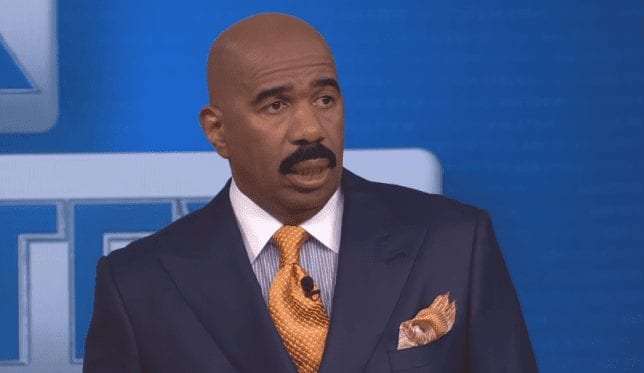 Steve Harvey in a suit and tie