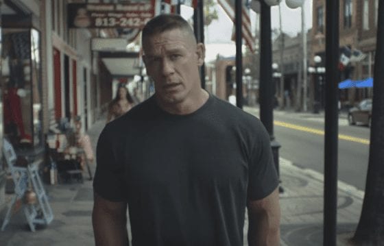 John Cena standing on a sidewalk