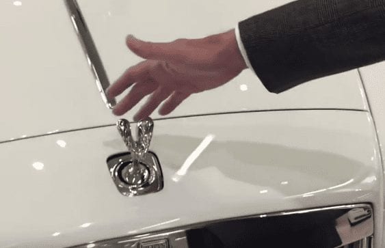 A hand holding a faucet