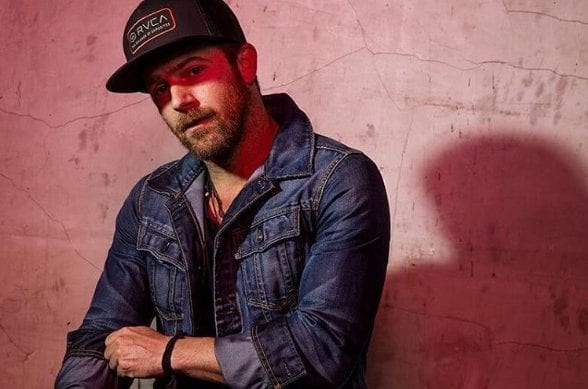 Kip Moore wearing a hat and a blue jacket