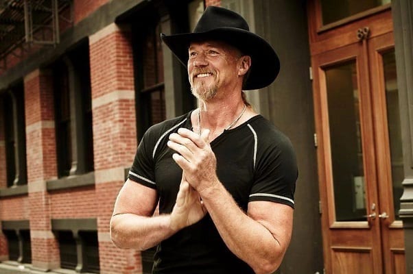 Trace Adkins wearing a black hat and a black shirt