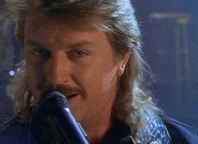 Joe Diffie with a microphone
