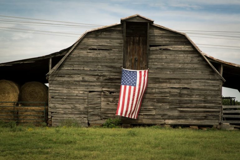 A flag on a barn