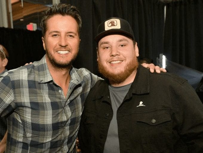 Luke Bryan, Luke Combs are posing for a picture