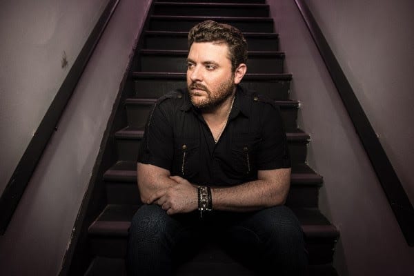 Chris Young sitting on stairs