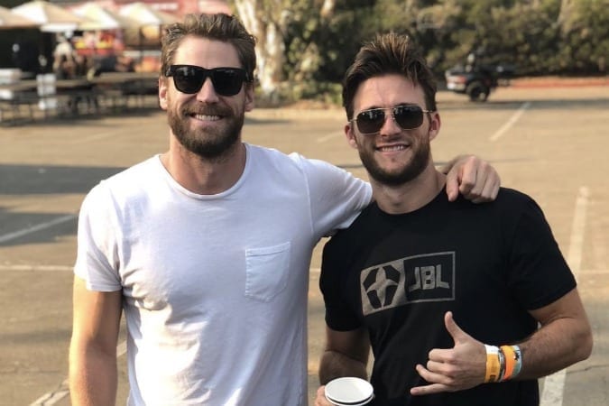 Chase Rice, Scott Eastwood are posing for a picture