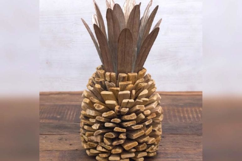 A pineapple with coins on it