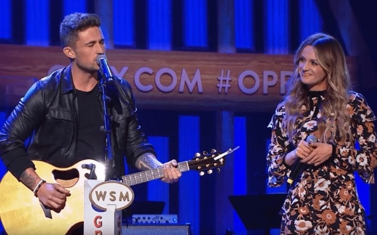 Michael Ray and woman playing guitar