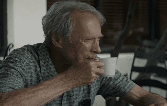 A man holding a cup