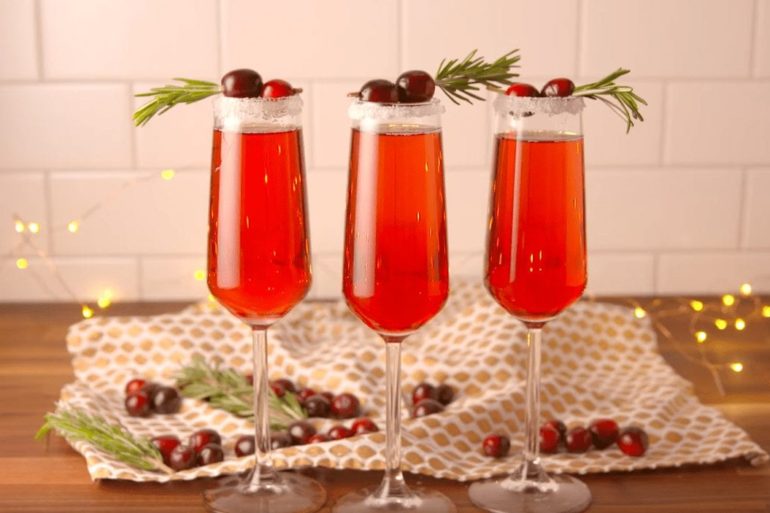A row of glasses with red liquid