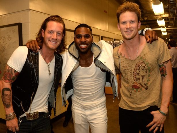 Brian Kelley, Tyler Hubbard, Jason Derulo are posing for a picture