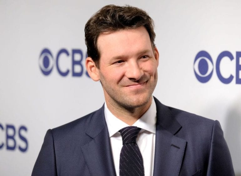 Tony Romo in a suit and tie