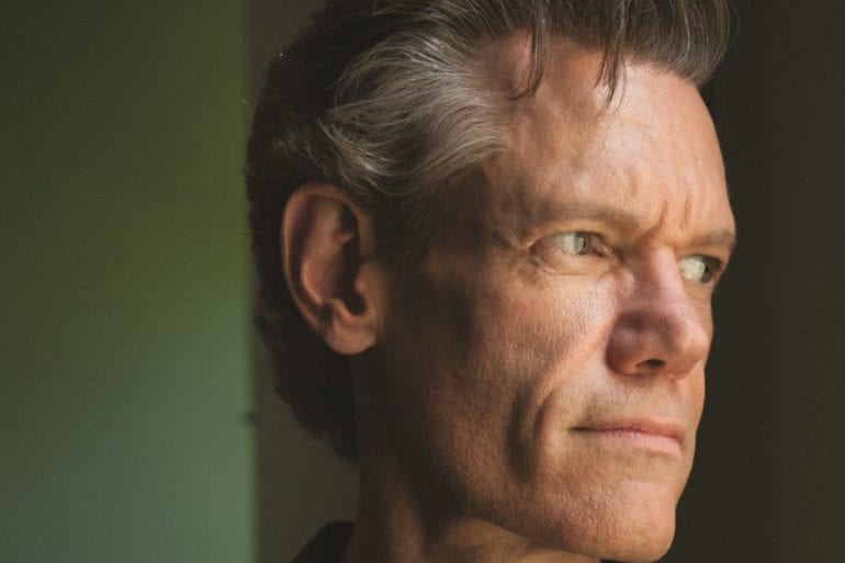 Randy Travis with a serious expression