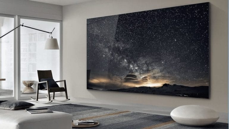 A large black screen in a room