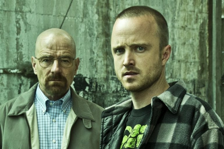 Aaron Paul, Bryan Cranston are posing for a picture