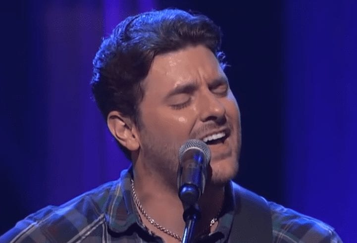 Chris Young singing into a microphone