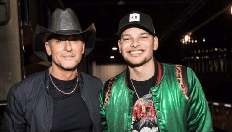Tim McGraw, Kane Brown are posing for a picture