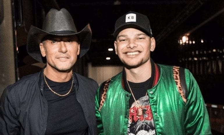 Tim McGraw, Kane Brown are posing for a picture