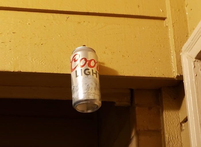 A can of soda on a shelf