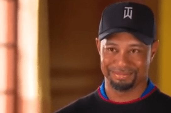 Tiger Woods wearing a baseball cap