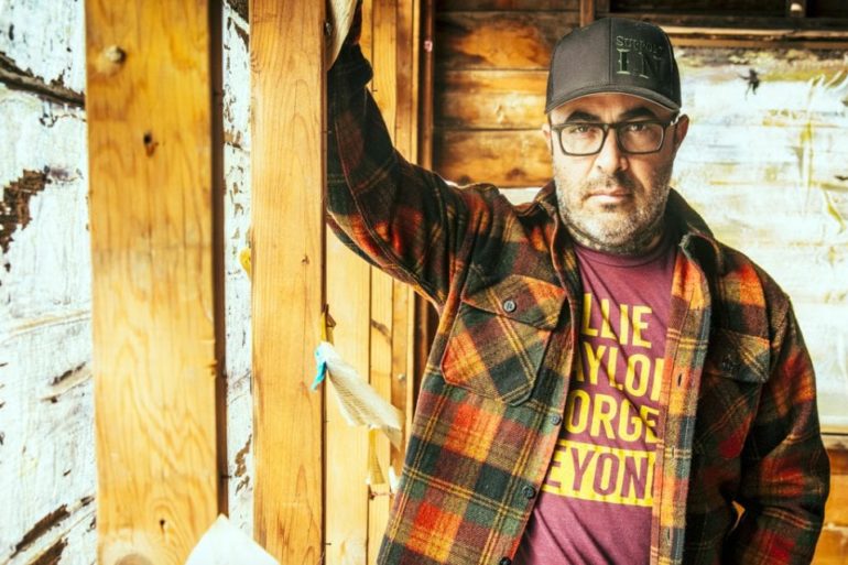 Aaron Lewis wearing glasses and a hat