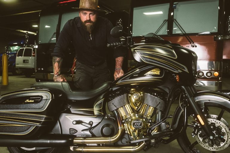 Zac Brown sitting on a motorcycle