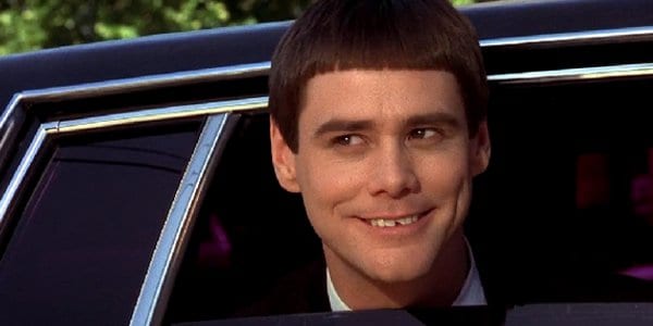 Jim Carrey smiling in a car