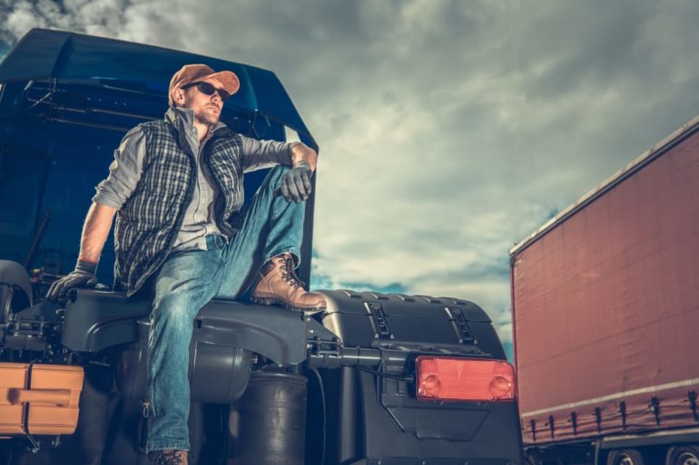 A man sitting on a truck