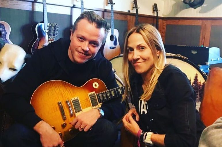 Jason Isbell, Sheryl Crow are posing for a picture