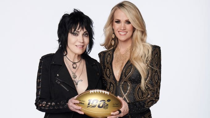 Joan Jett, Carrie Underwood are posing for a picture