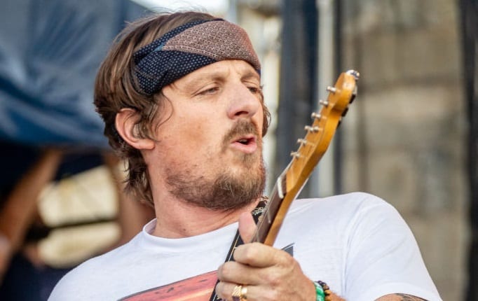 Sturgill Simpson playing a flute