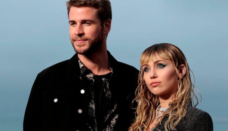 Liam Hemsworth, Miley Cyrus are posing for a picture