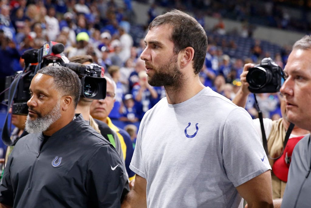 Andrew Luck with a camera on his shoulder