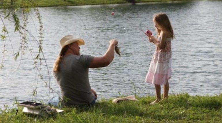 A person and a girl fishing