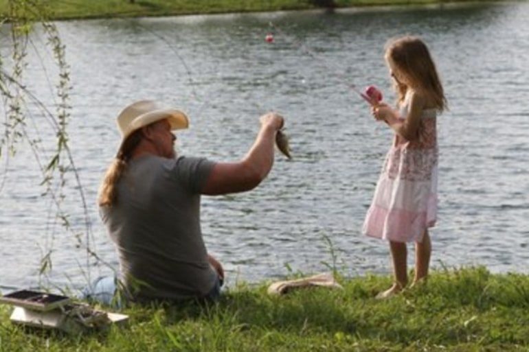 A person and a girl fishing