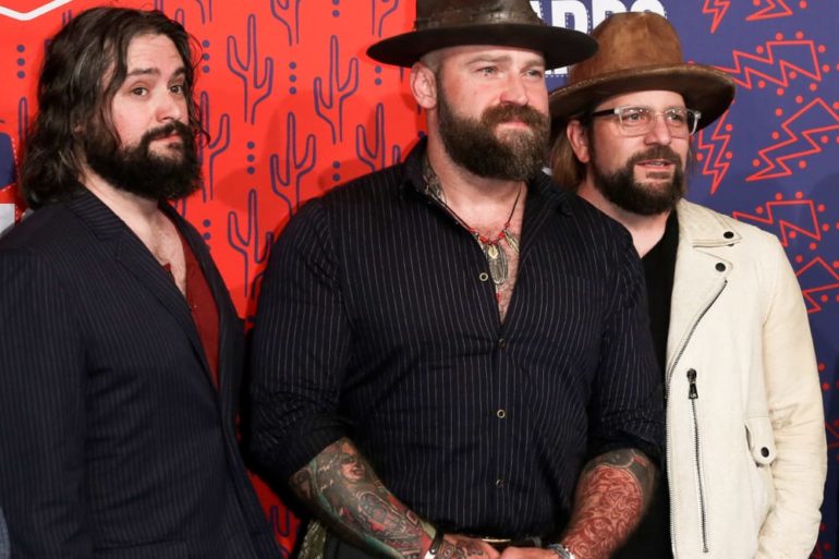 Zac Brown, Clay Cook et al. are posing for a picture