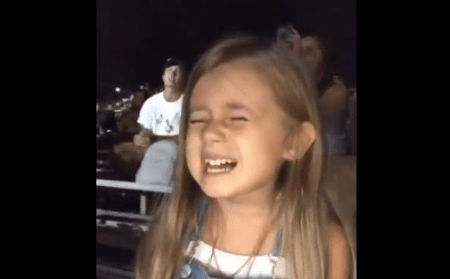 A girl laughing and smiling