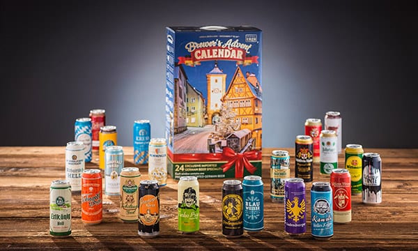 A group of cans and bottles of beer on a table