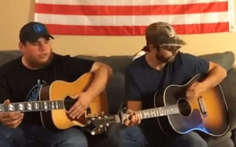 Two men playing guitars