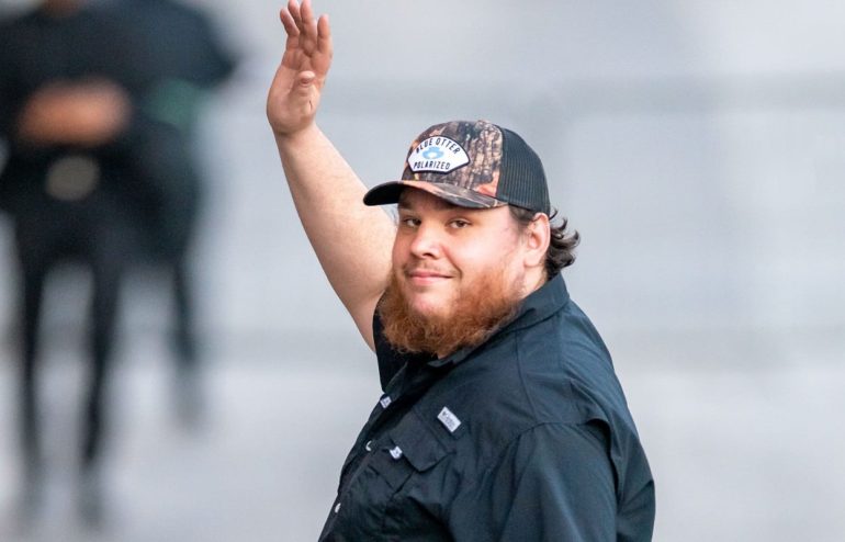 Luke Combs with a beard and hat