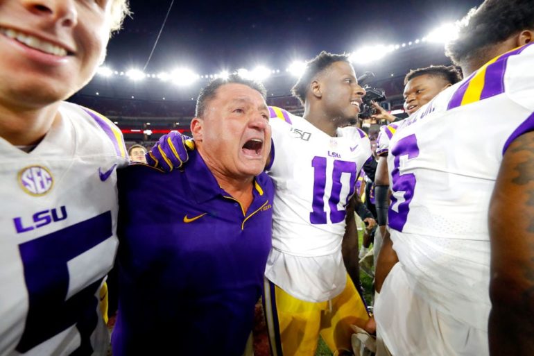 Ed Orgeron yelling at another man