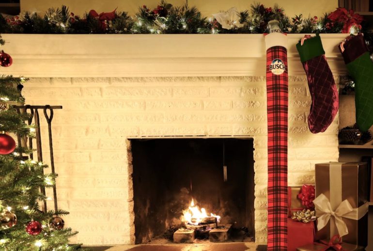 A fireplace with christmas decorations